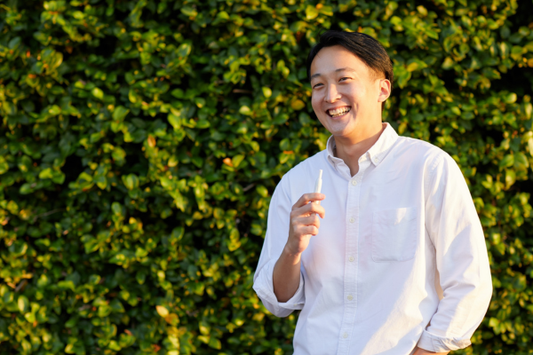 Smiling man with a oil vape pen