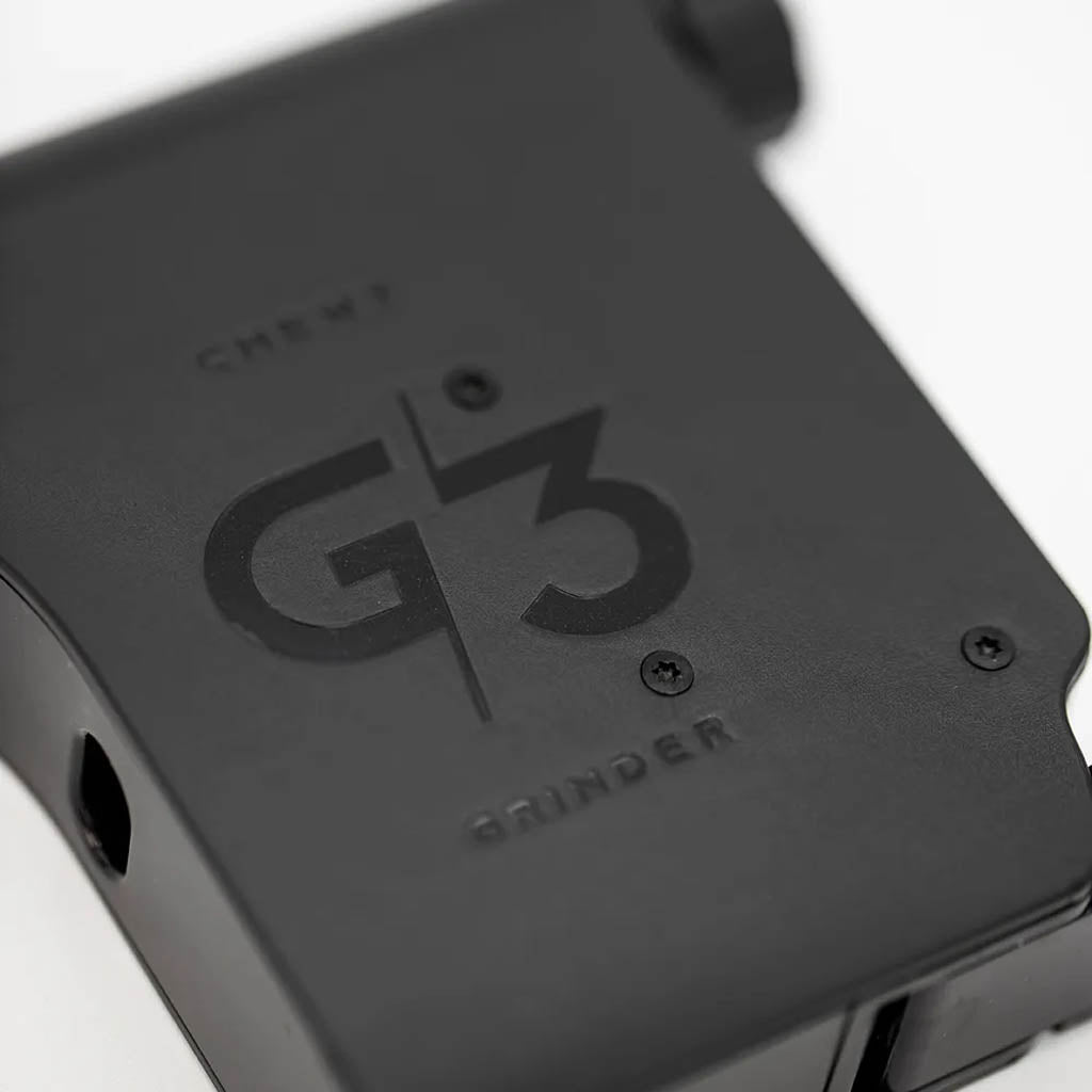 Close-up view of Chewy G3 Deluxe Electronic Grinder showing name and logo