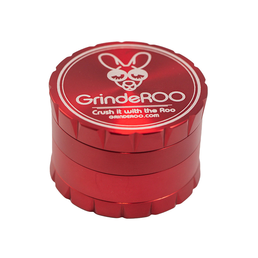 Red GrindeROO OG 4-part metal herb grinder shown with closed lid, highlighting the bold color and durable aluminium exterior design.