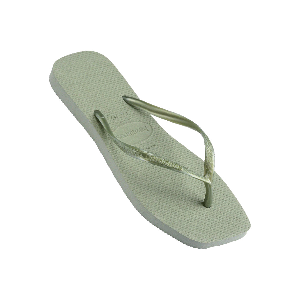Angled view of green Havaianas Slim Square Toe Thongs displaying the logo on the strap. 
