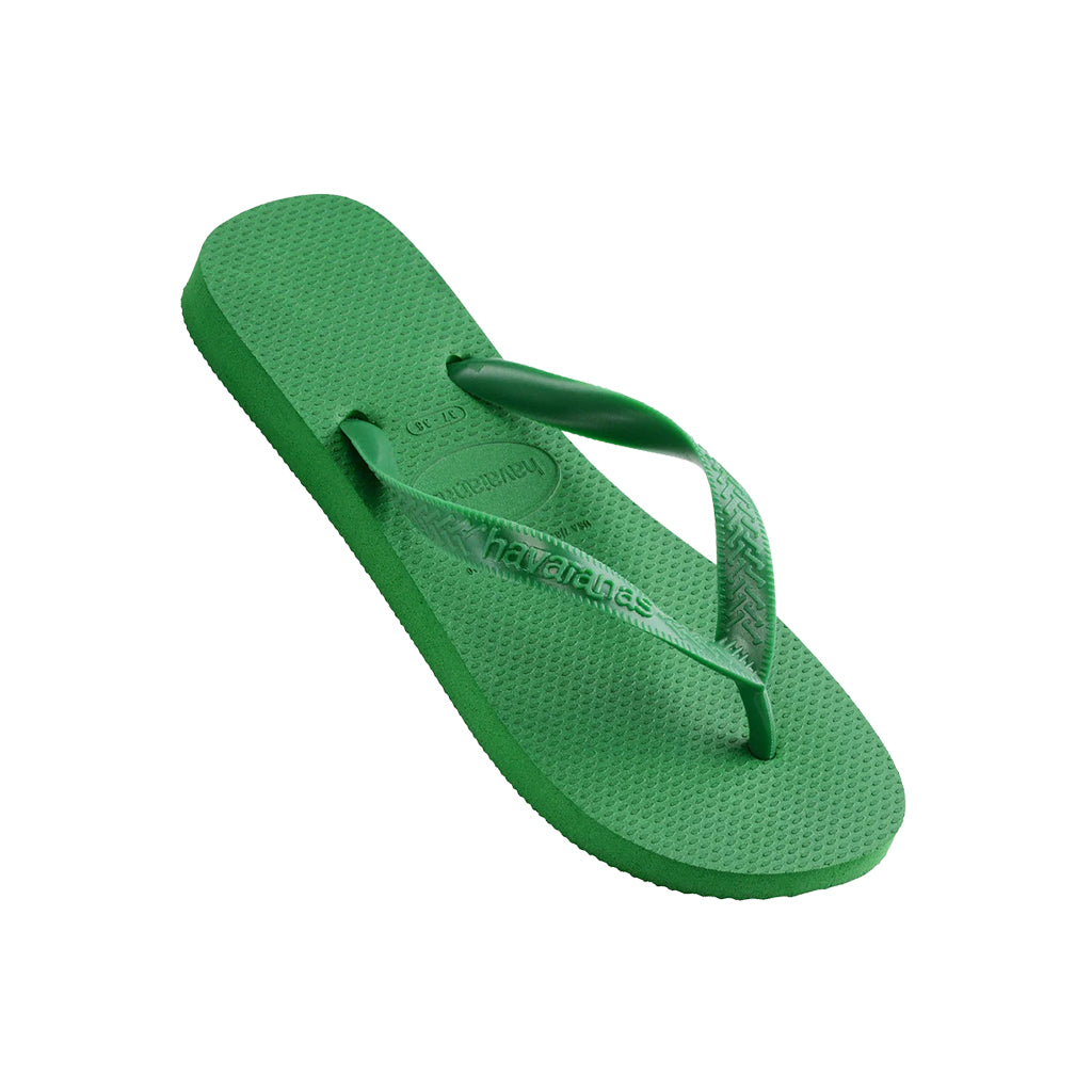 Angled view of green Havaianas Top Thongs displaying the Havaianas logo on the strap.