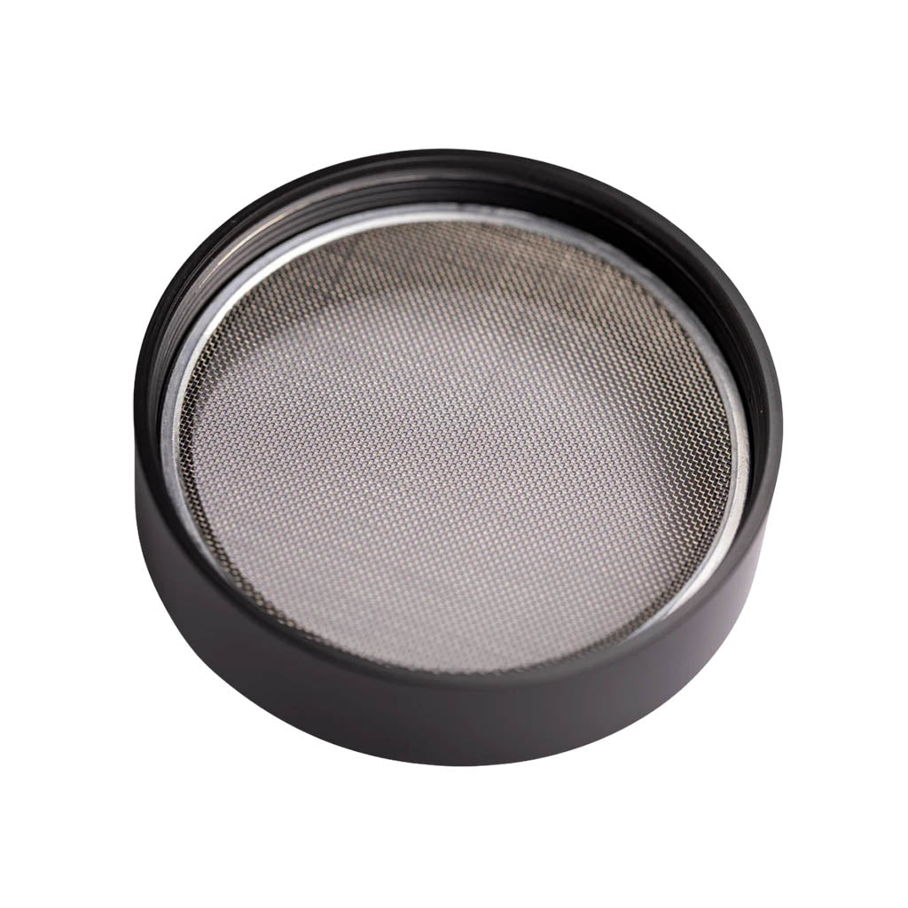 Close-up of the stainless steel mesh screen from the MightyROO Fifth Edition Grinder, showcasing its fine filtration detail.
