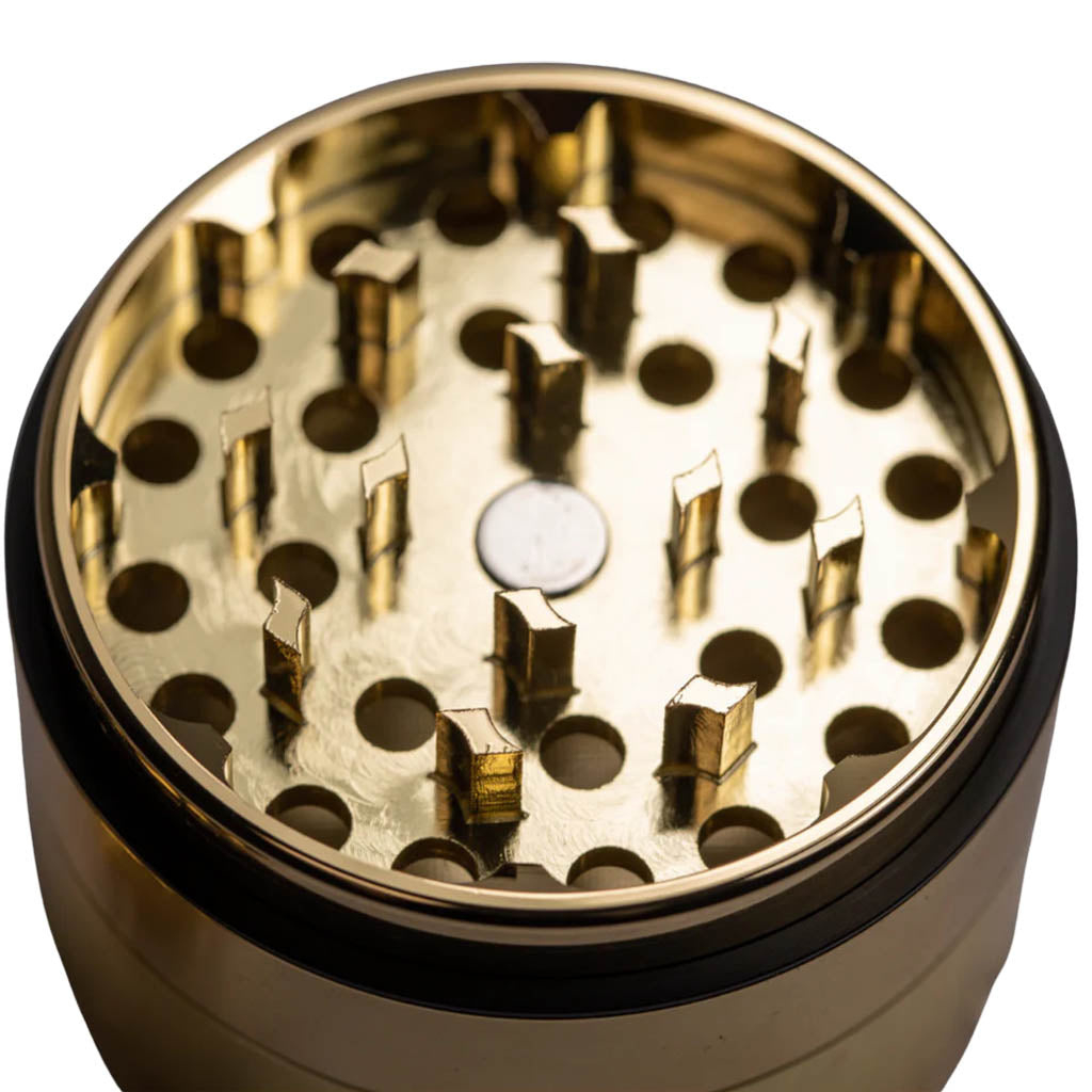Close-up of the MightyROO Fifth Edition Grinder teeth, showcasing its sharp details.